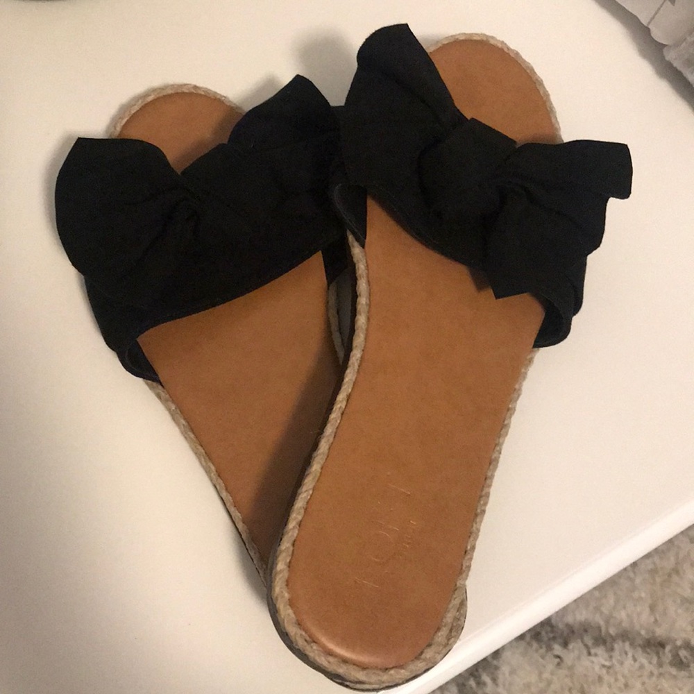 Black slip on flat sandals